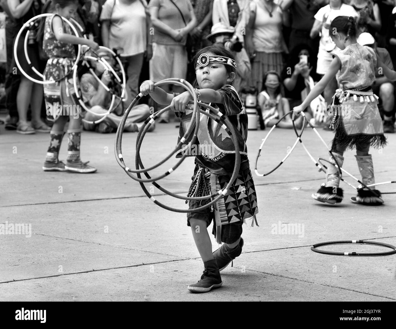Young Native American hoop dancers perform at the annual Santa Fe Indian Market in Santa Fe, New Mexico. Stock Photo