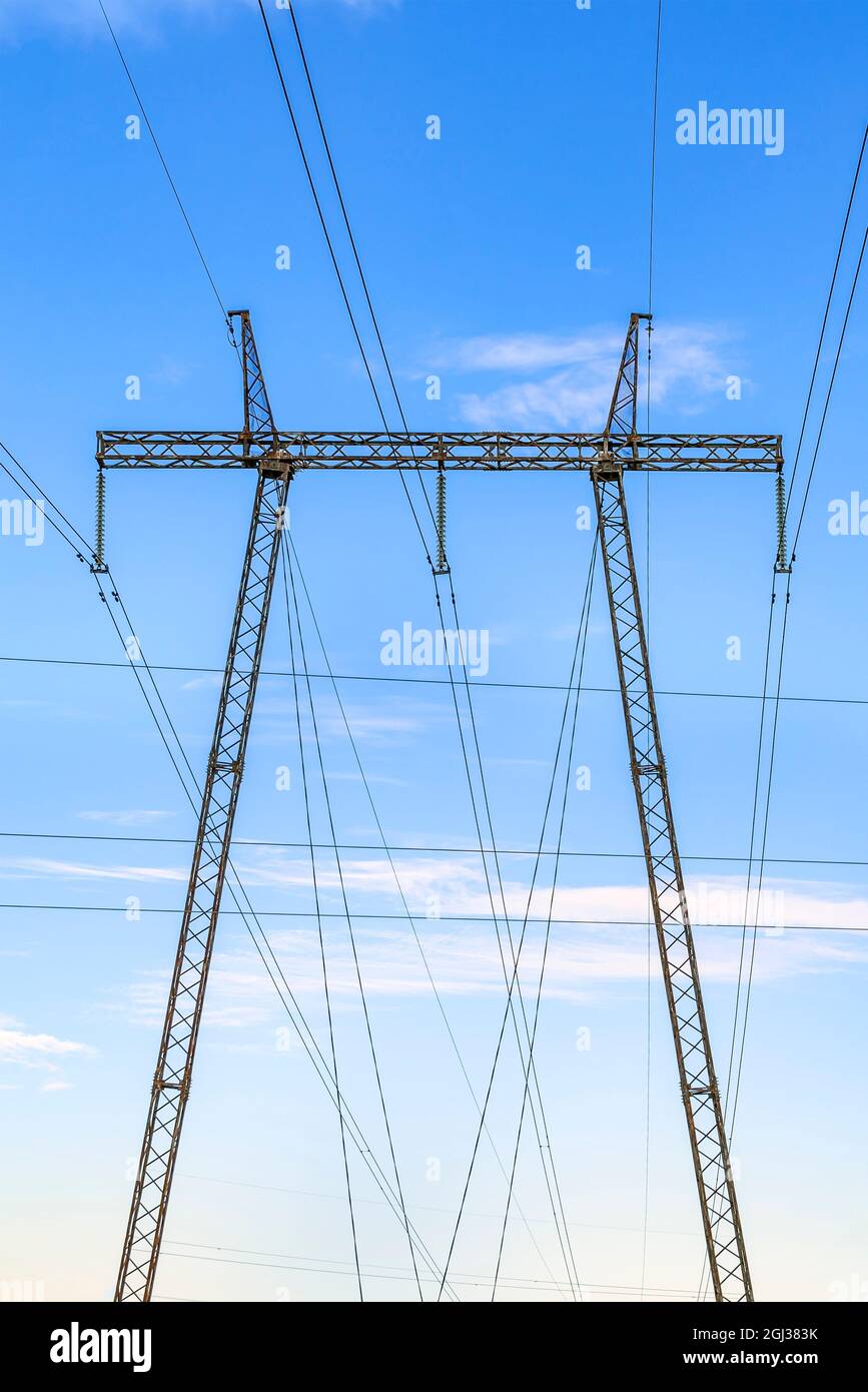 High voltage pillar. Power grid pole against the sky. High voltage ...