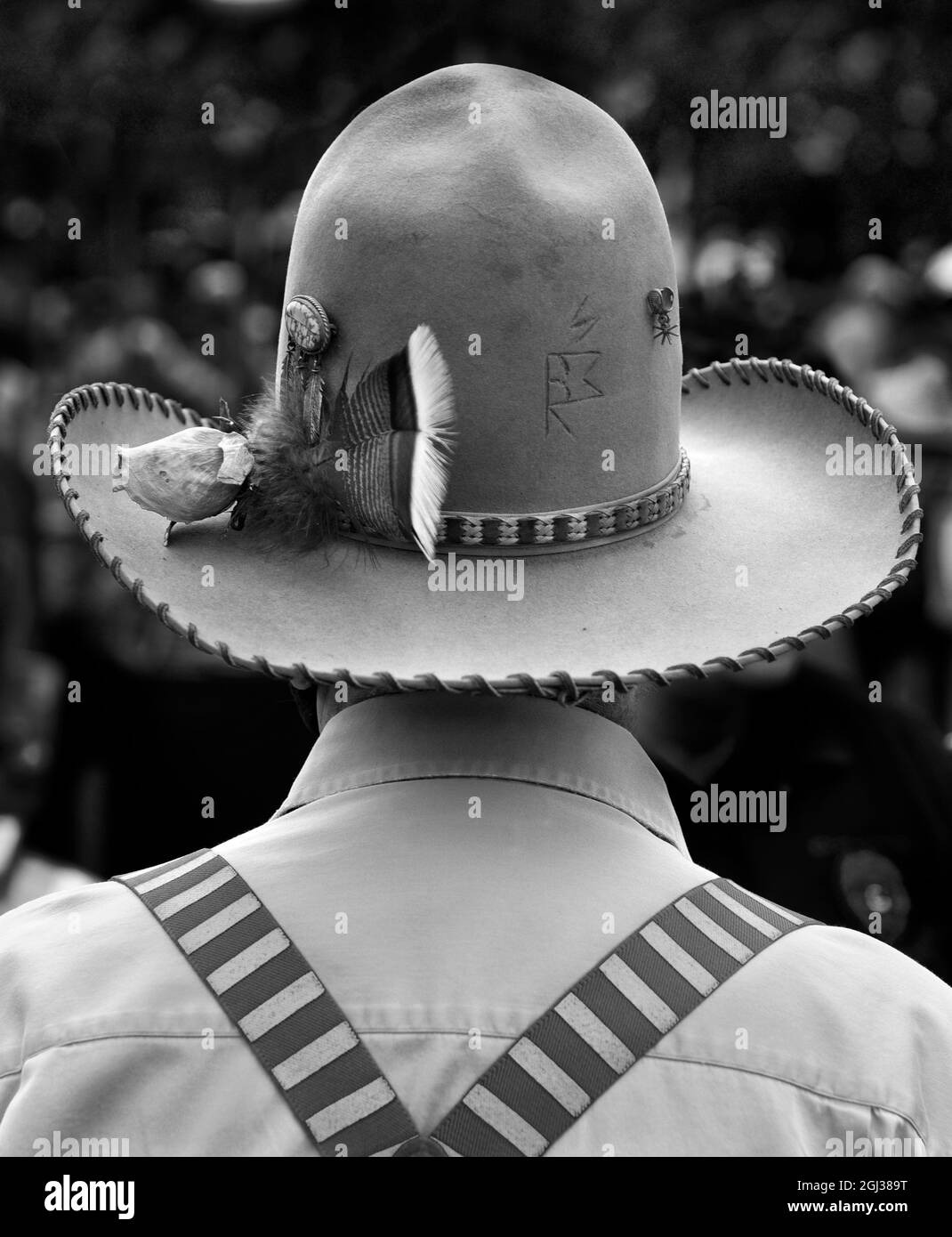 A man wears an embellished cowboy hat and suspenders in Santa Fe, New Mexico. Stock Photo