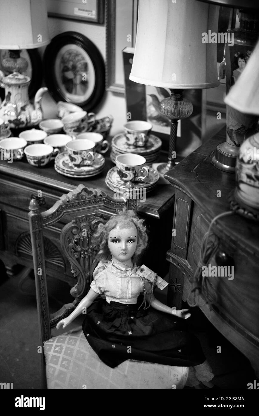 A 19th century French doll and china for sale in an antique shop in Santa Fe, New Mexico. Stock Photo