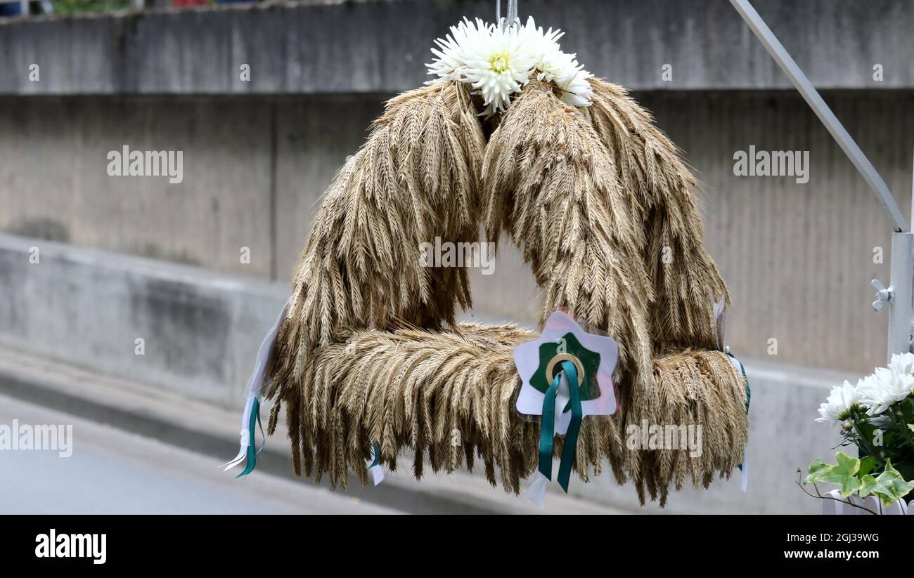 BREMEN, GERMANY - Sep 08, 2021: at harvest festivals it is a tradition to hang them in front of the tractorsin autumn there are many harvest festivals Stock Photo