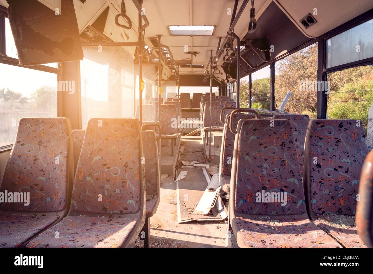 Old and damaged Bus is waiting in garage for fixing the maintenance and renewing. High quality photo Stock Photo