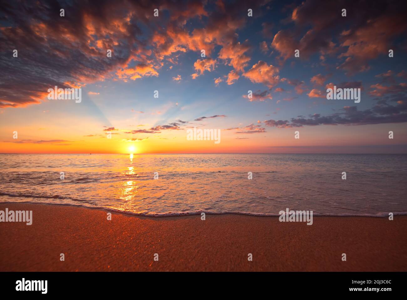 Beach sunrise over the tropical sea Stock Photo - Alamy
