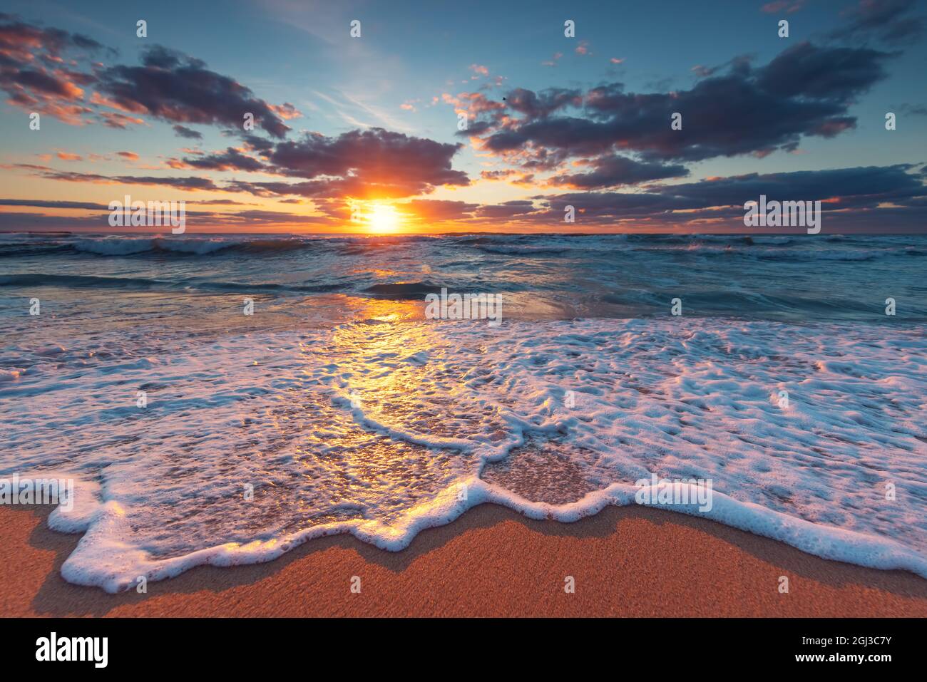 Beach sunrise over the tropical sea Stock Photo - Alamy