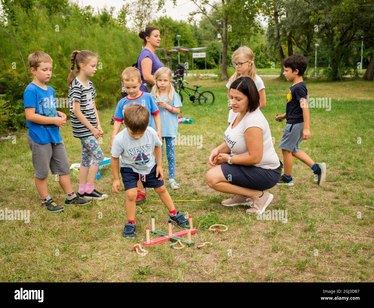 Happy child playing park grass hi-res stock photography and images - Alamy