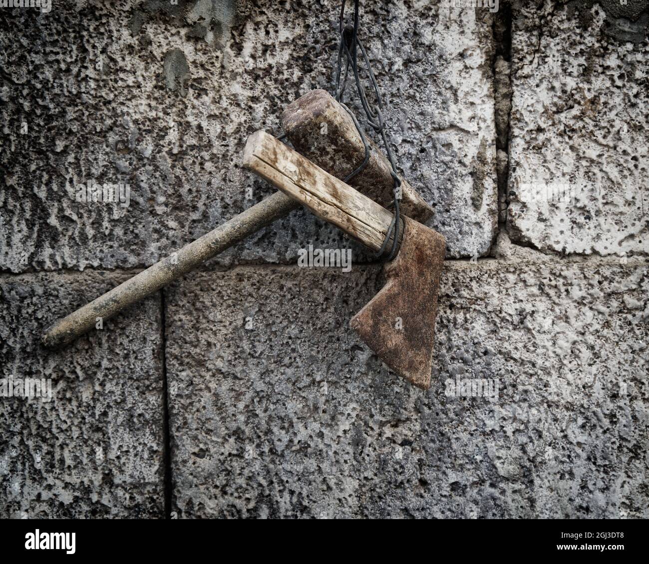 Closeup shot of old tools hanging on the wall Stock Photo