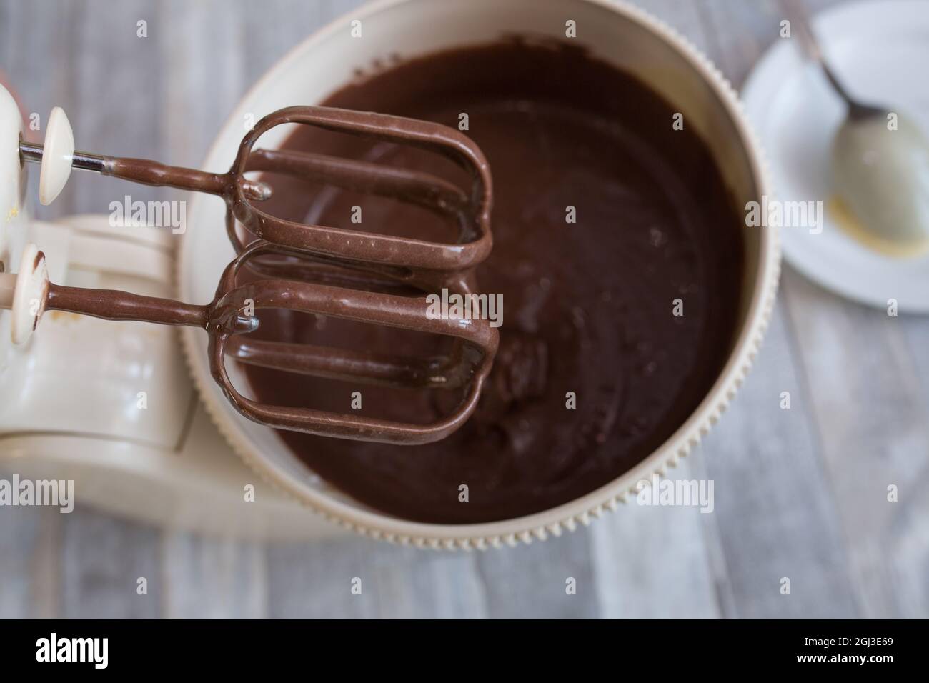 Cake making process. The dough is ready. The mixer beaters are stopped. Step by step recipe for chocolate cake. Series. Baking concept. Stock Photo