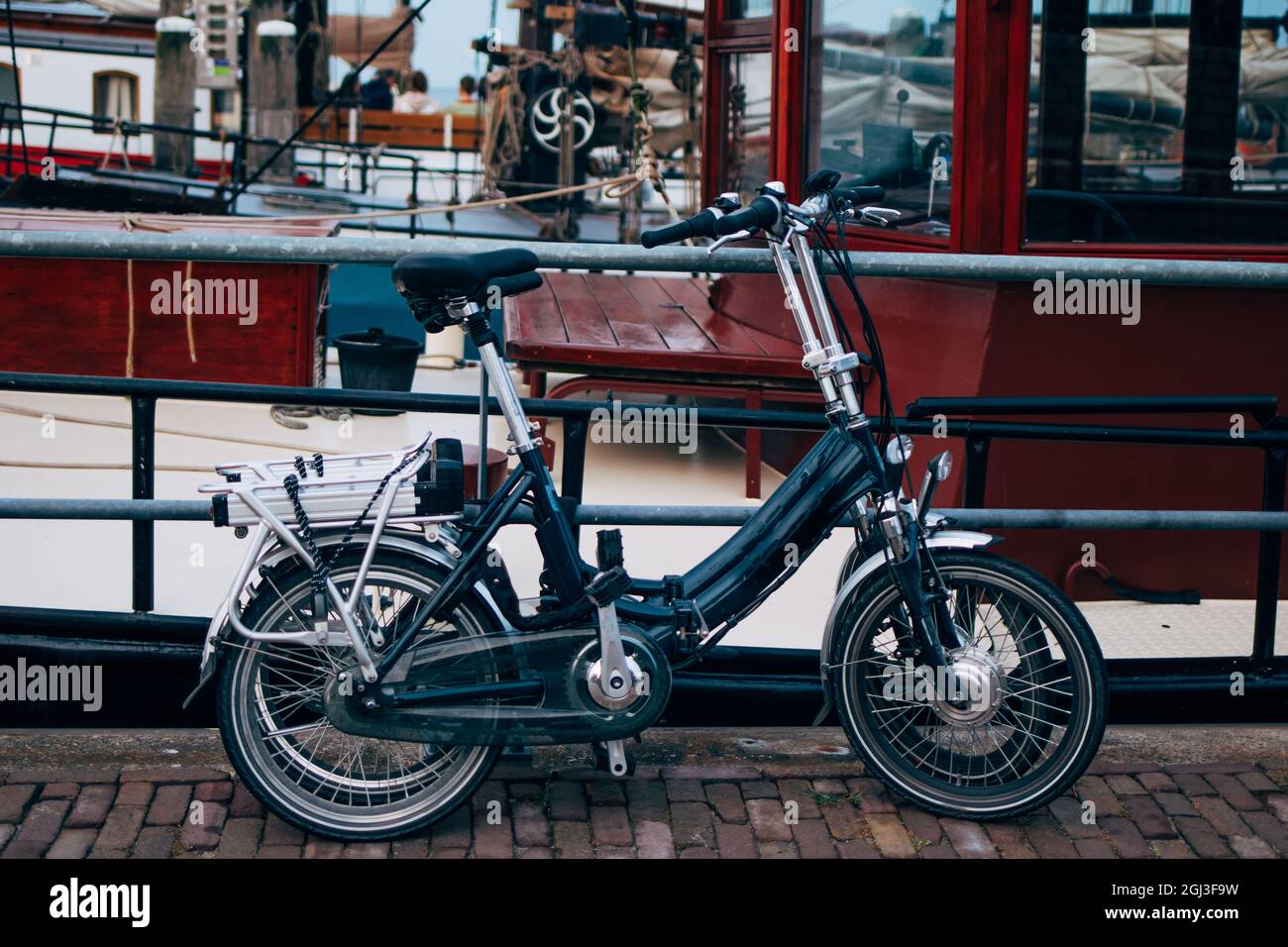 Collapsible mini electric bike for Dutch tourism - environment friendly convenient bicycle transport Stock Photo