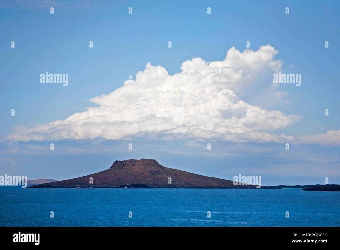 Cumulus and stratus cloud formations over Sombrero Chino island in the Galapagos Islands, Ecuador Stock Photo