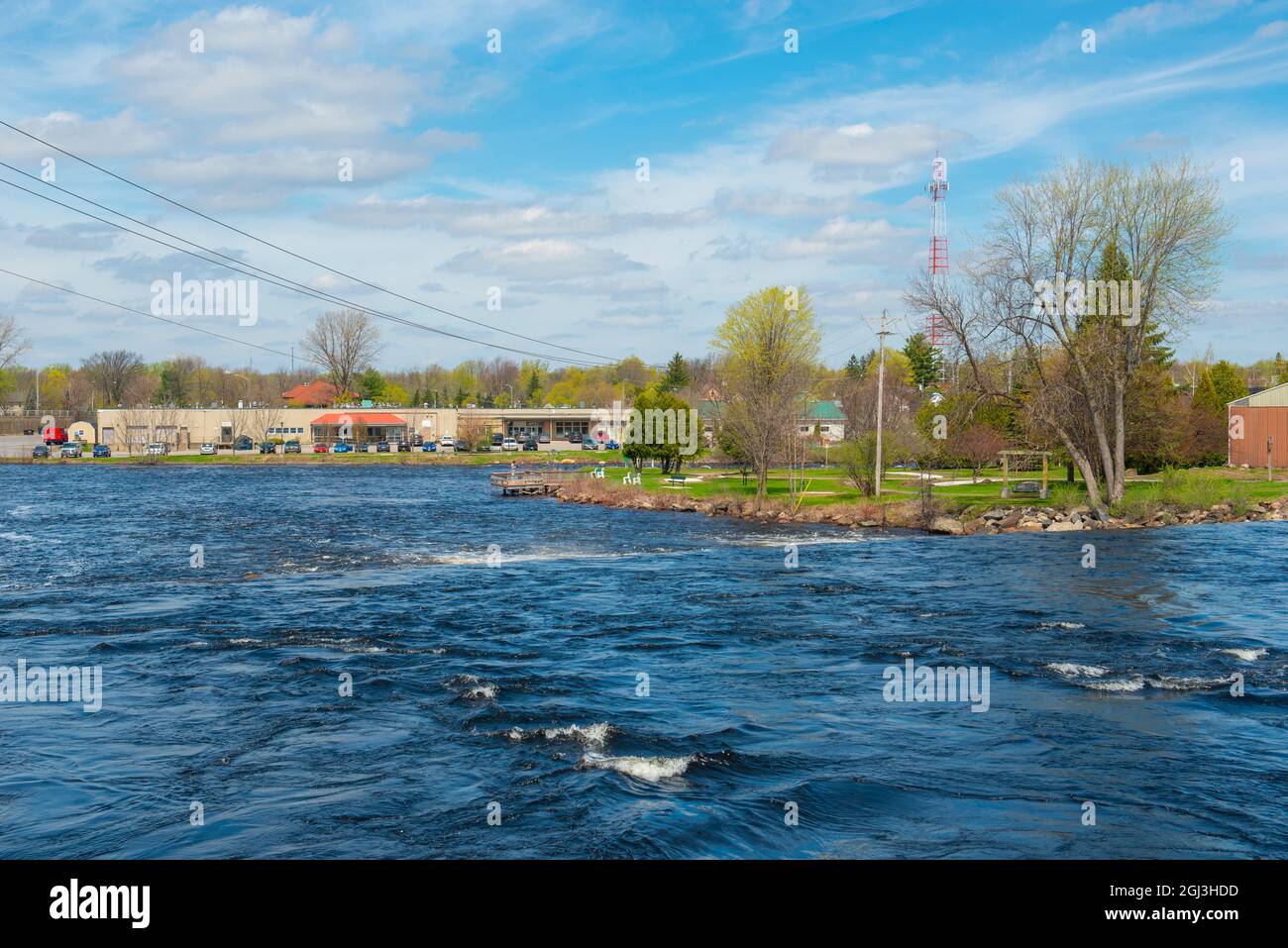 Racquet River flows in historic town center of Potsdam in spring