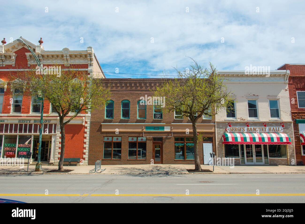 Historic sandstone and brick commercial buildings with Italianate style