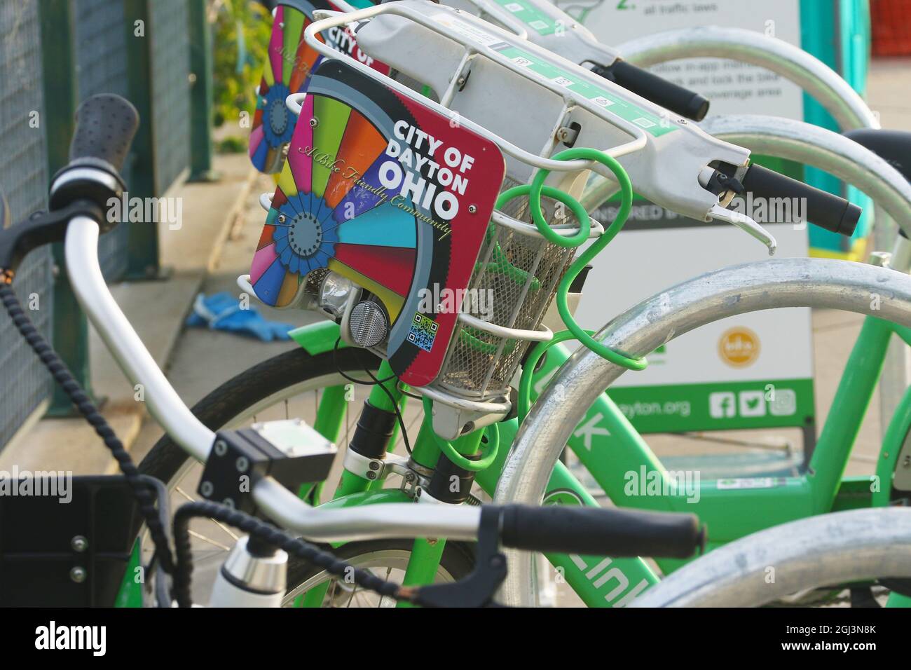 Link branded rental bicycle with placard reading City Of Dayton, A Bike Friendly Community. Note some dirt or scratches on the sign placard. Dayton, O Stock Photo