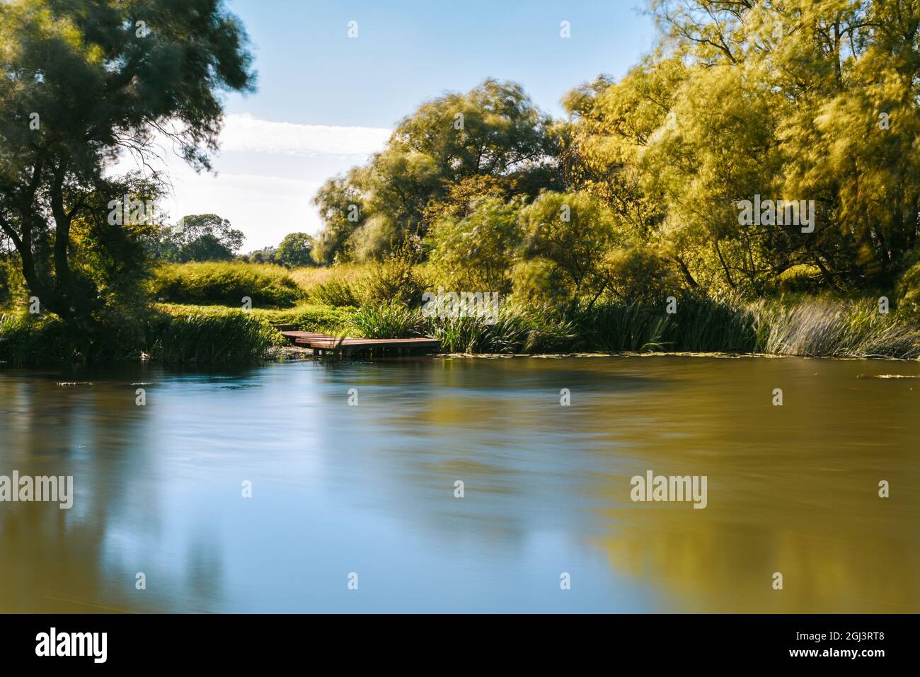 Calm water on a lake in a quiet countryside location Stock Photo