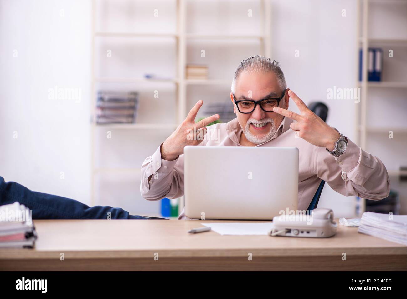 Old businessman employee working at workplace Stock Photo - Alamy