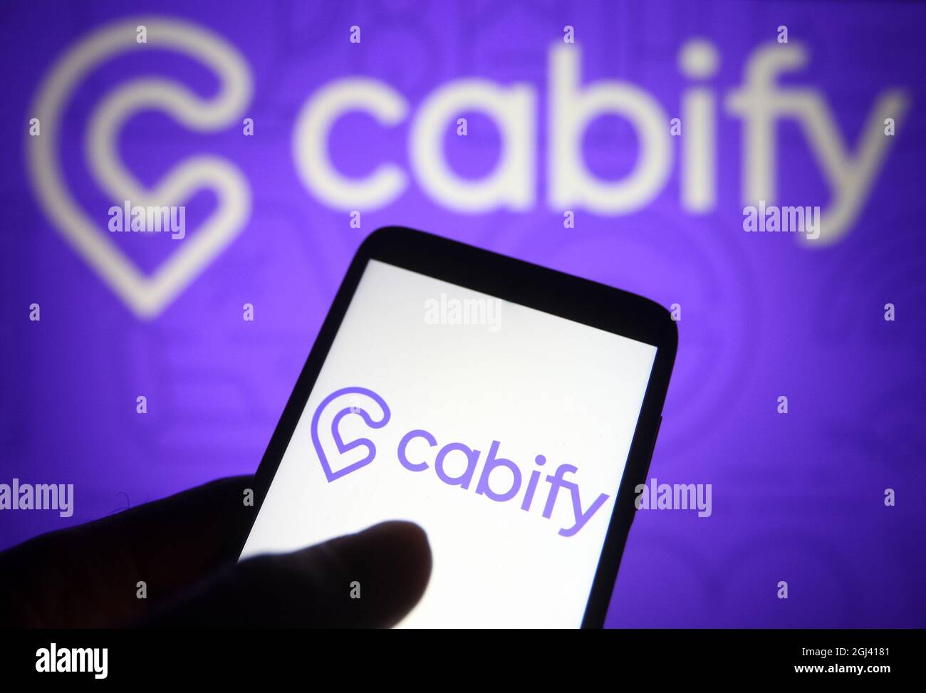 In this photo illustration a Cabify logo of a Spanish ridesharing