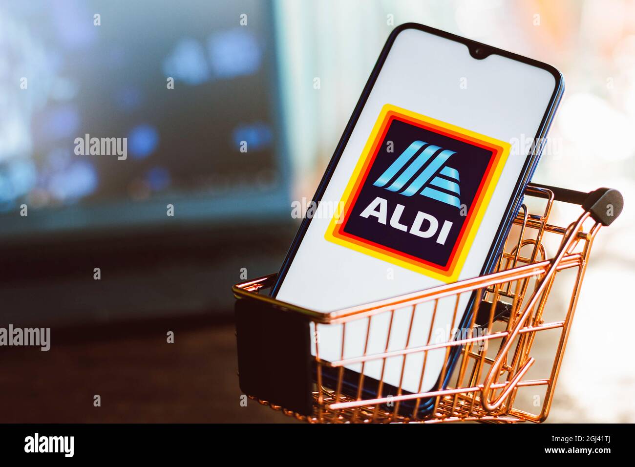 In this photo illustration, an Aldi logo seen displayed on a smartphone ...