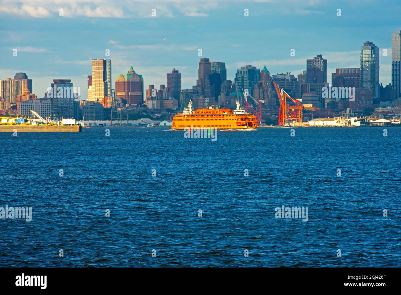 A Staten Island ferry boat crossing in front of Governor's Island in