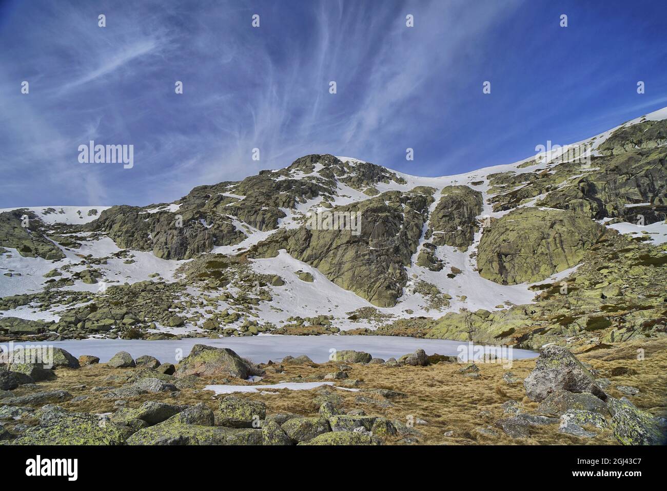 Scenic view of mountains covered in snow on a blue sky background Stock ...