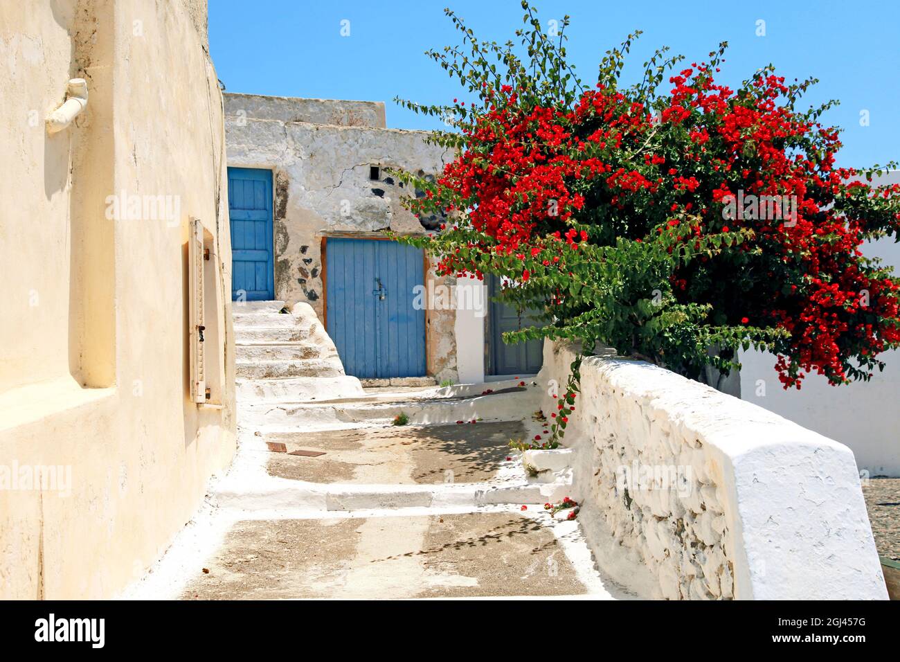 White walls and blue doors in the traditional village of Megalochori in Santorini, Greece. Stock Photo
