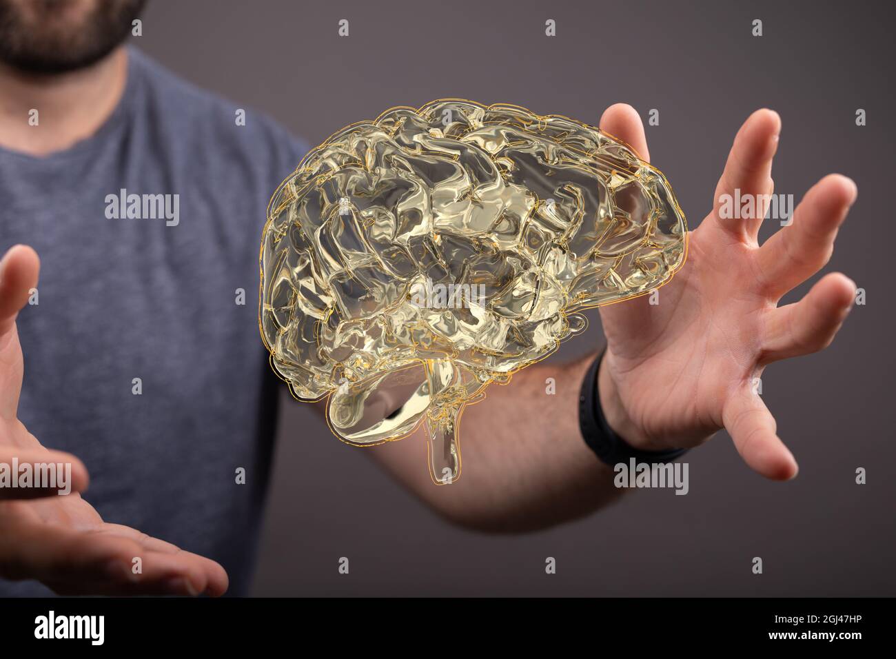 3D rendering of a gold human brain floating in the air with a man ...