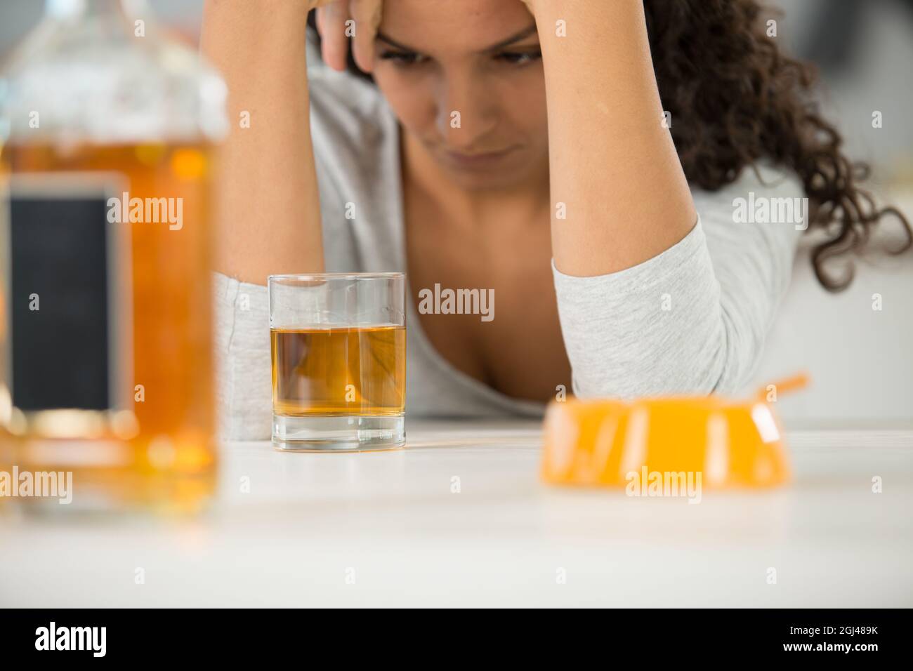 young woman drinking alcohol at home Stock Photo Alamy
