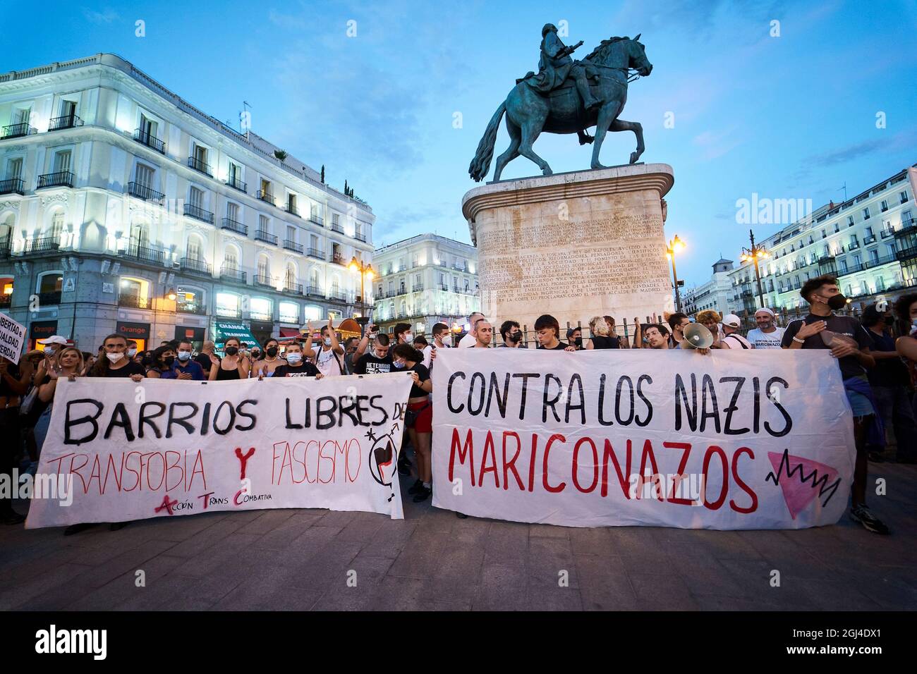 Madrid, Madrid, Spain. 8th Sep, 2021. Protesters hold banners with the slogan 'Barrios libres de Transfobia y Fascismo'' (Transphobia and Fascism free neighborhoods) at the left and 'Contra los Nazis, mariconazos'' (Against the Nazis, fagots) at the right during the demonstration against homofobic violence at Puerta del Sol in Madrid, Spain. The demonstration has been called after several homophobic attacks in different cities of Spain. (Credit Image: © Angel Perez/ZUMA Press Wire) Credit: ZUMA Press, Inc./Alamy Live News Stock Photo