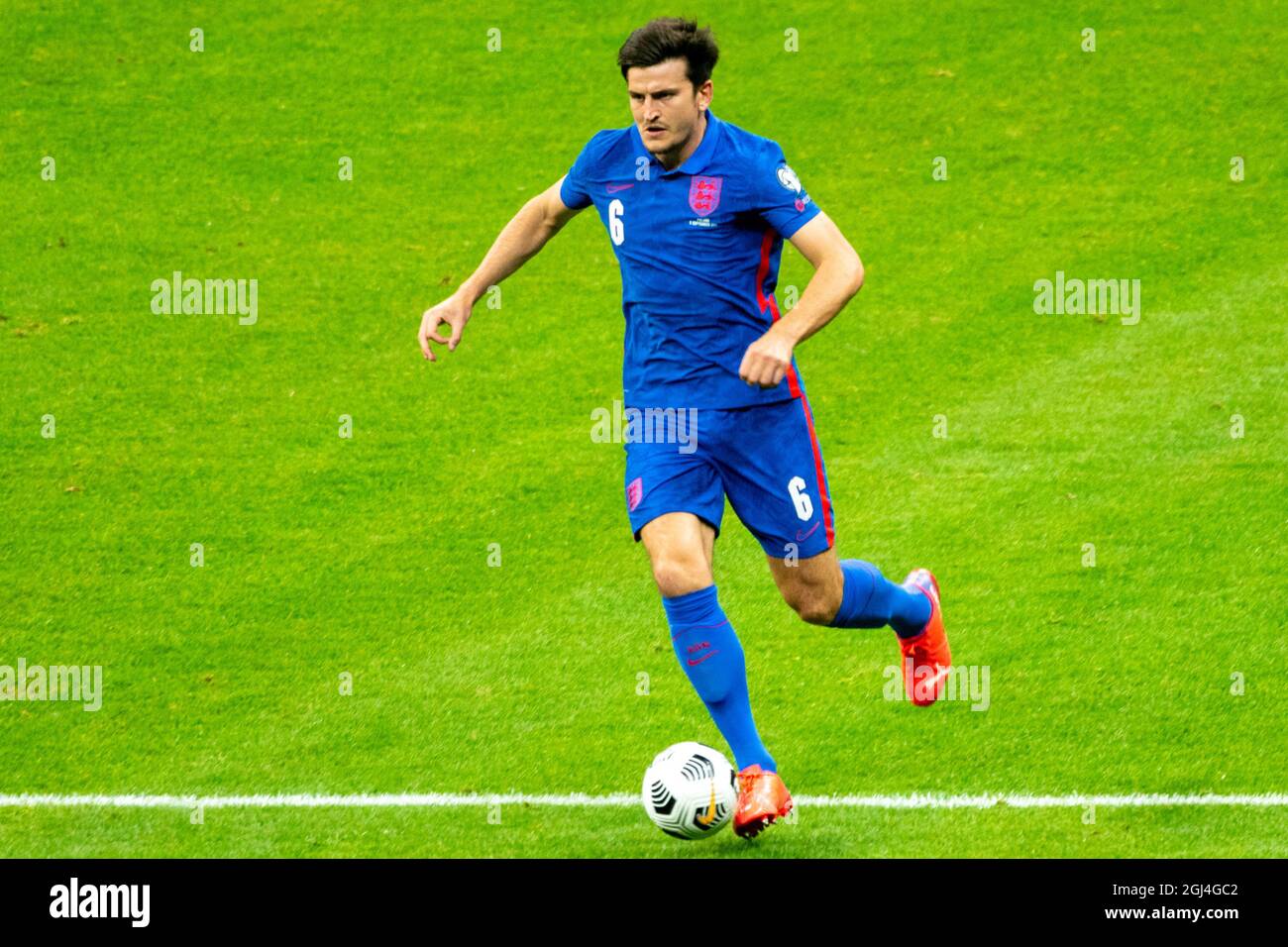 Warsaw, Poland. 08th Sep, 2021. Harry Maguire of England runs with the ball during the 2022 FIFA World Cup Qualifier Group I match between Poland and England at PGE National Stadium in Warsaw, Poland on September 8, 2021 (Photo by Andrew SURMA/ Credit: Sipa USA/Alamy Live News Stock Photo