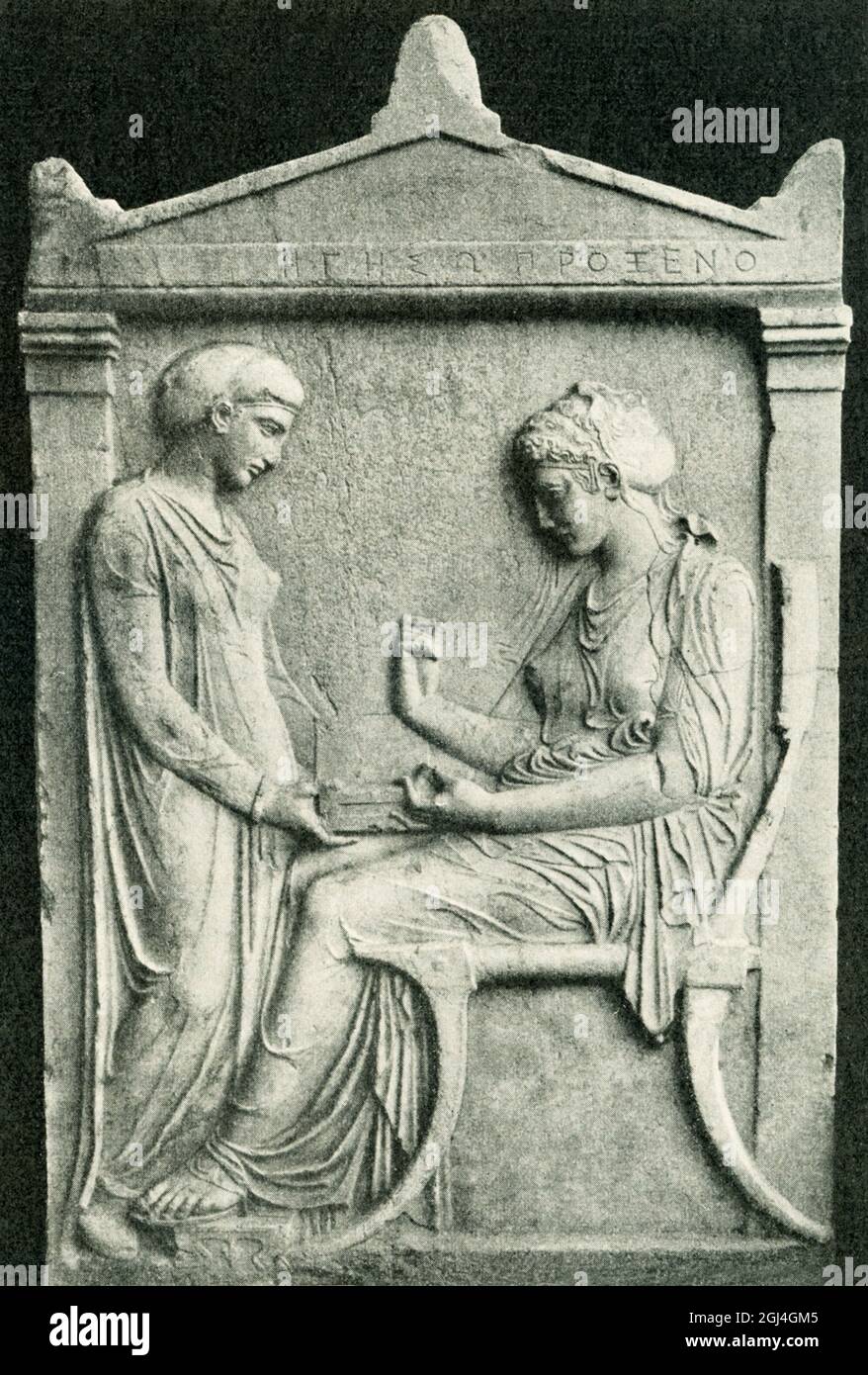The Grave Stele of Hegeso (c. 410–400 BC) is one of the best surviving examples of Attic grave stelae. A contemplative seated woman picks jewelry from a box held for her by a standing slave-girl. The jewelry would have been painted on to the marble surface. The deceased woman’s name is inscribed above (Hegeso daughter of Proxenos). The relief was found in the ancient cemetery of Athens, the Kerameikos. From around 450, Athenian funerary monuments increasingly depicted women, as their civic importance increased. Stock Photo