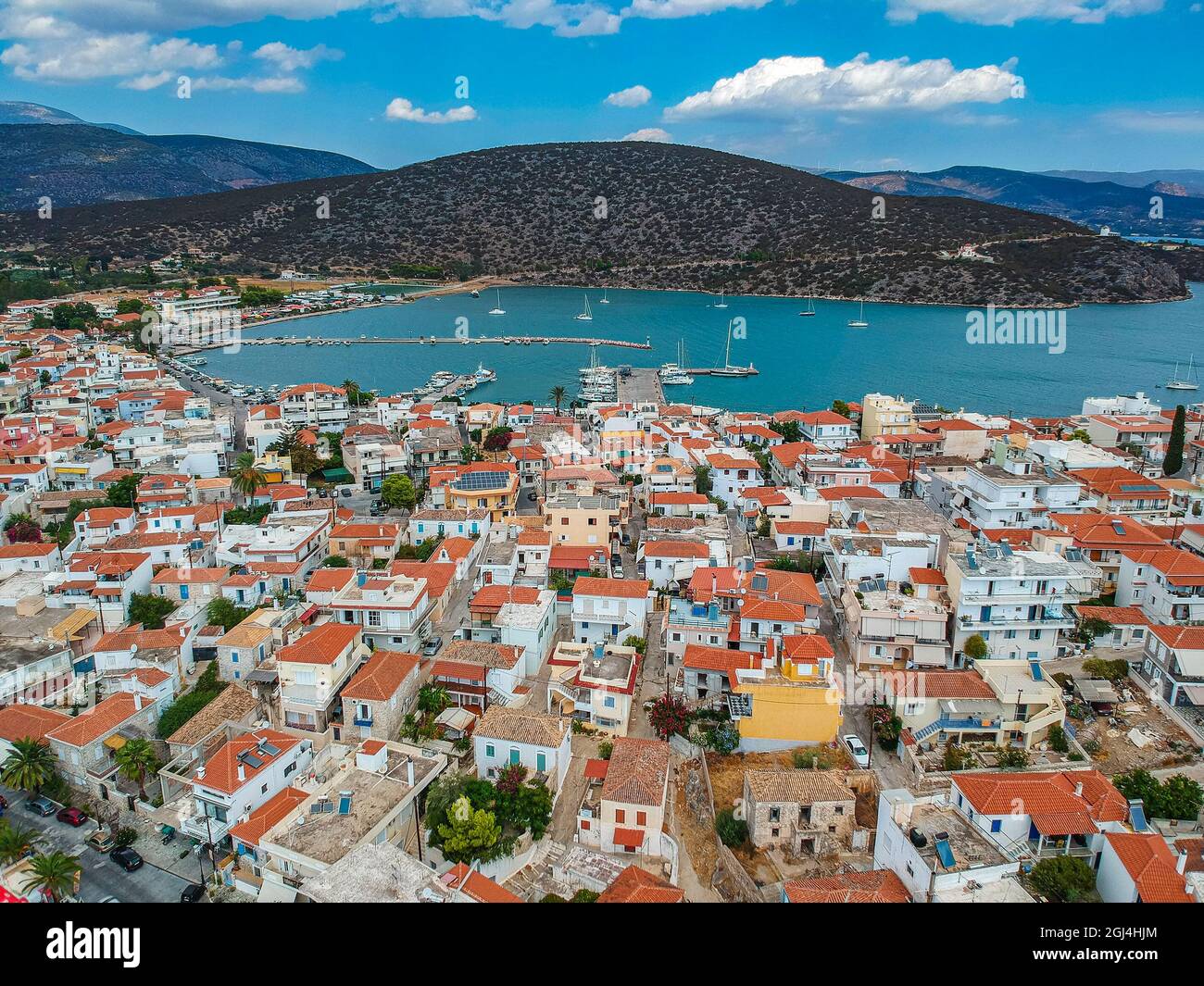 Aerial panoramic photo of picturesque seaside town of Ermioni built in peninsula with forest of Bistis at the end, Argolida, Peloponnese, Greece Stock Photo