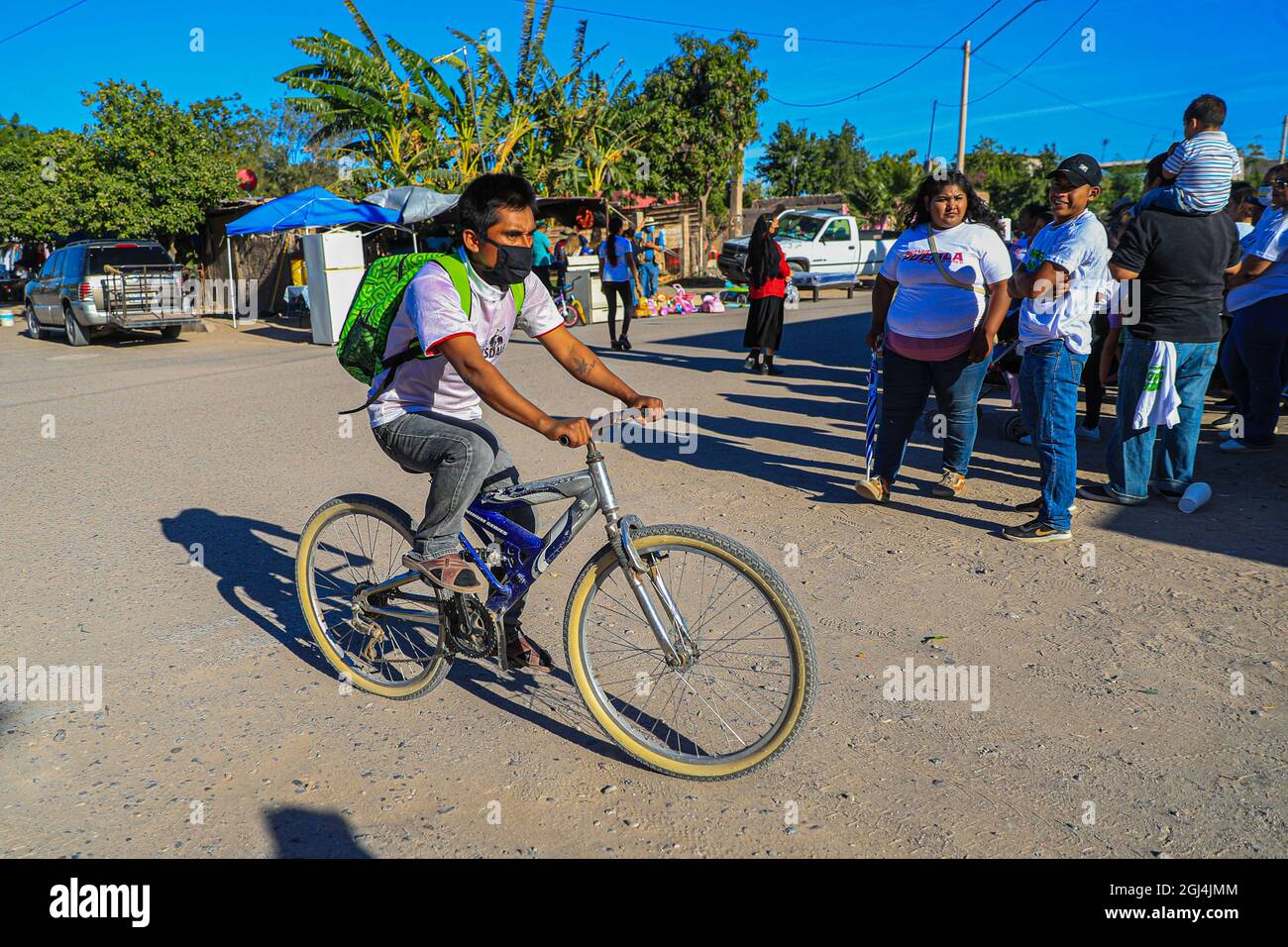A man moves by bicycle as a means of transportation and as part of life to  move the economy and micro businesses or informal economy. Daily life in  the extreme poverty community