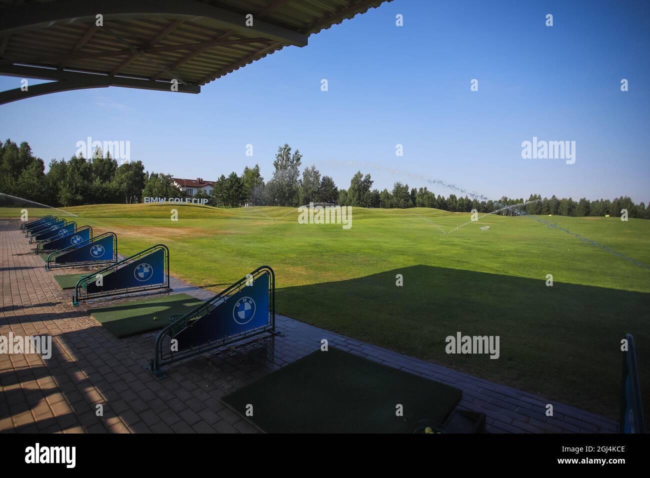 Golf course, green grass on the field, awning on the golf course Stock