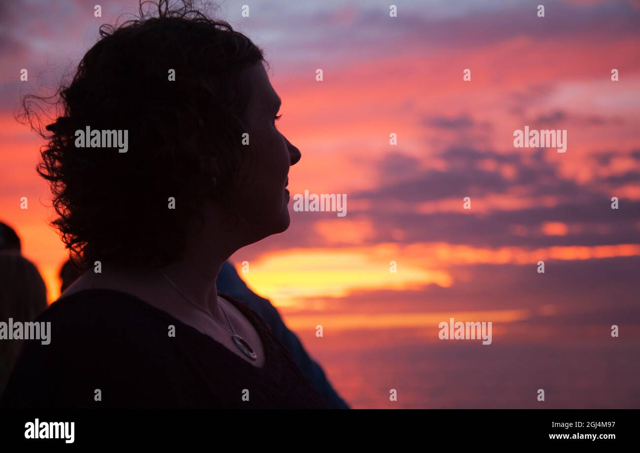Woman looking at sunset, Puerto Vallarta Mexico Stock Photo