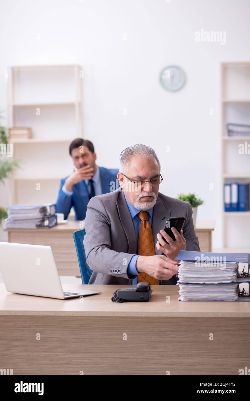 Two colleagues working at workplace Stock Photo