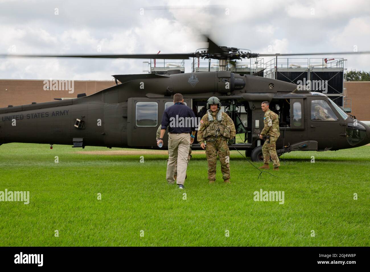 U.S. Army Corps of Engineers leaders, along with Louisiana state officials, board a Louisiana National Guard UH-60 Blackhawk at the Governor's Office of Homeland Security and Emergency Preparedness in Baton Rouge, Louisiana, Sept. 1, 2021. USACE is working closely with local, state and federal partners to respond to Hurricane Ida. (U.S. Army photo by Maj. Grace Geiger) Stock Photo
