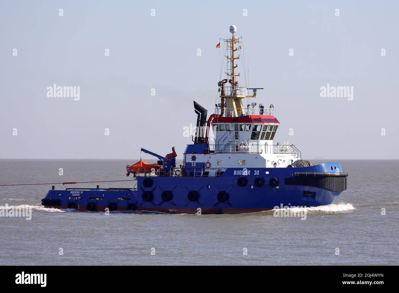 The offshore tug Bugsier 30 will pass Cuxhaven on June 14, 2021 on its way to Hamburg. Stock Photo