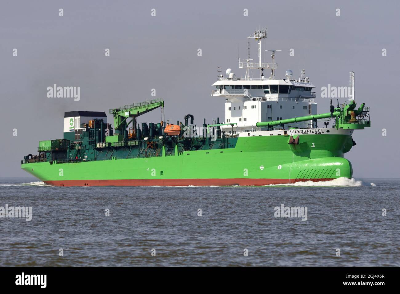 The hopper dredger Uilenspiegel is working on June 14, 2021 off Cuxhaven on the Elbe. Stock Photo