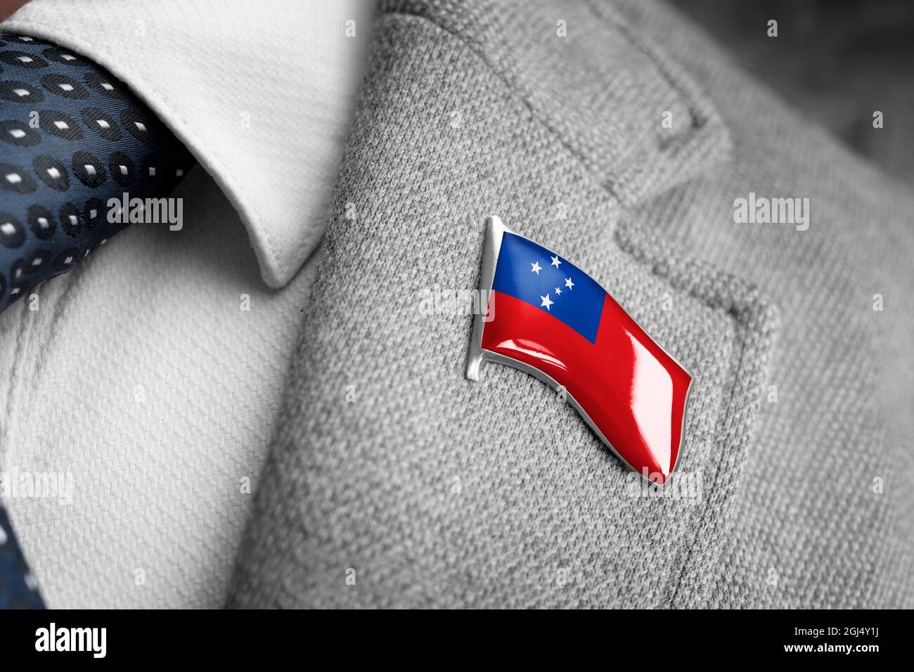 Metal badge with the flag of Samoa on a suit lapel Stock Photo