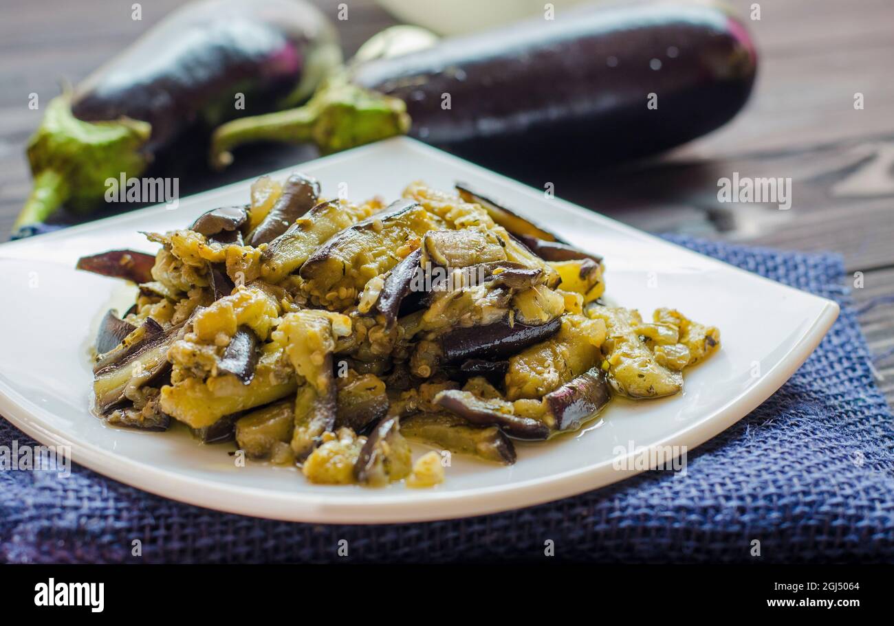 fried eggplants with garlic on a plate Stock Photo Alamy