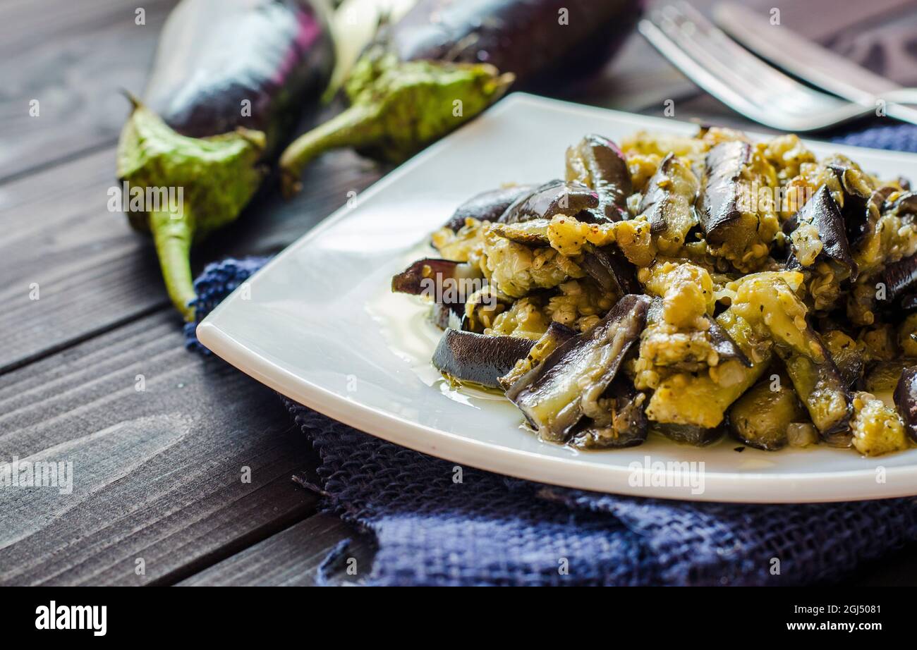 fried eggplants with garlic on a plate Stock Photo Alamy