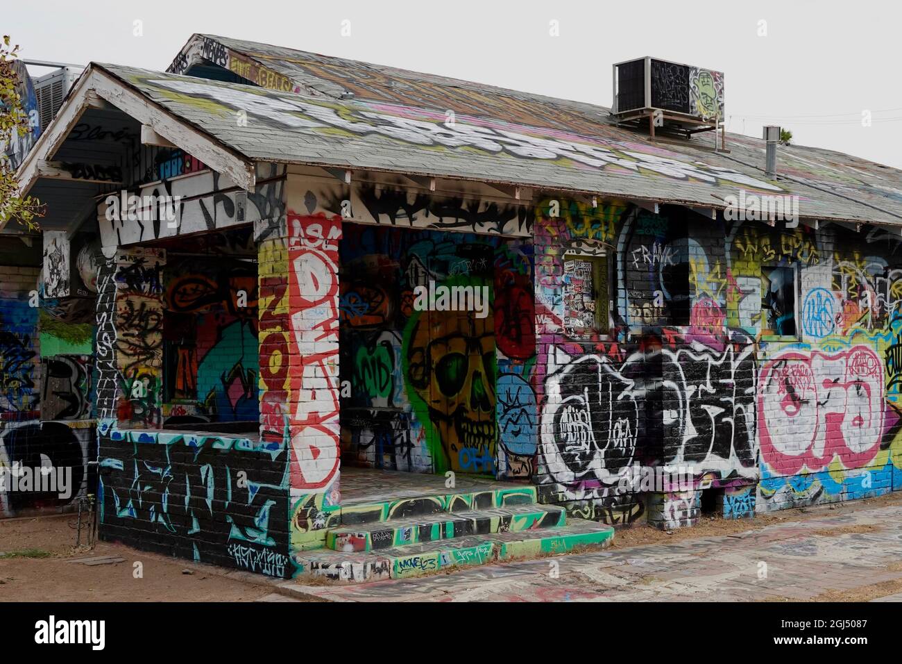 An abandoned house covered in graffiti. Stock Photo