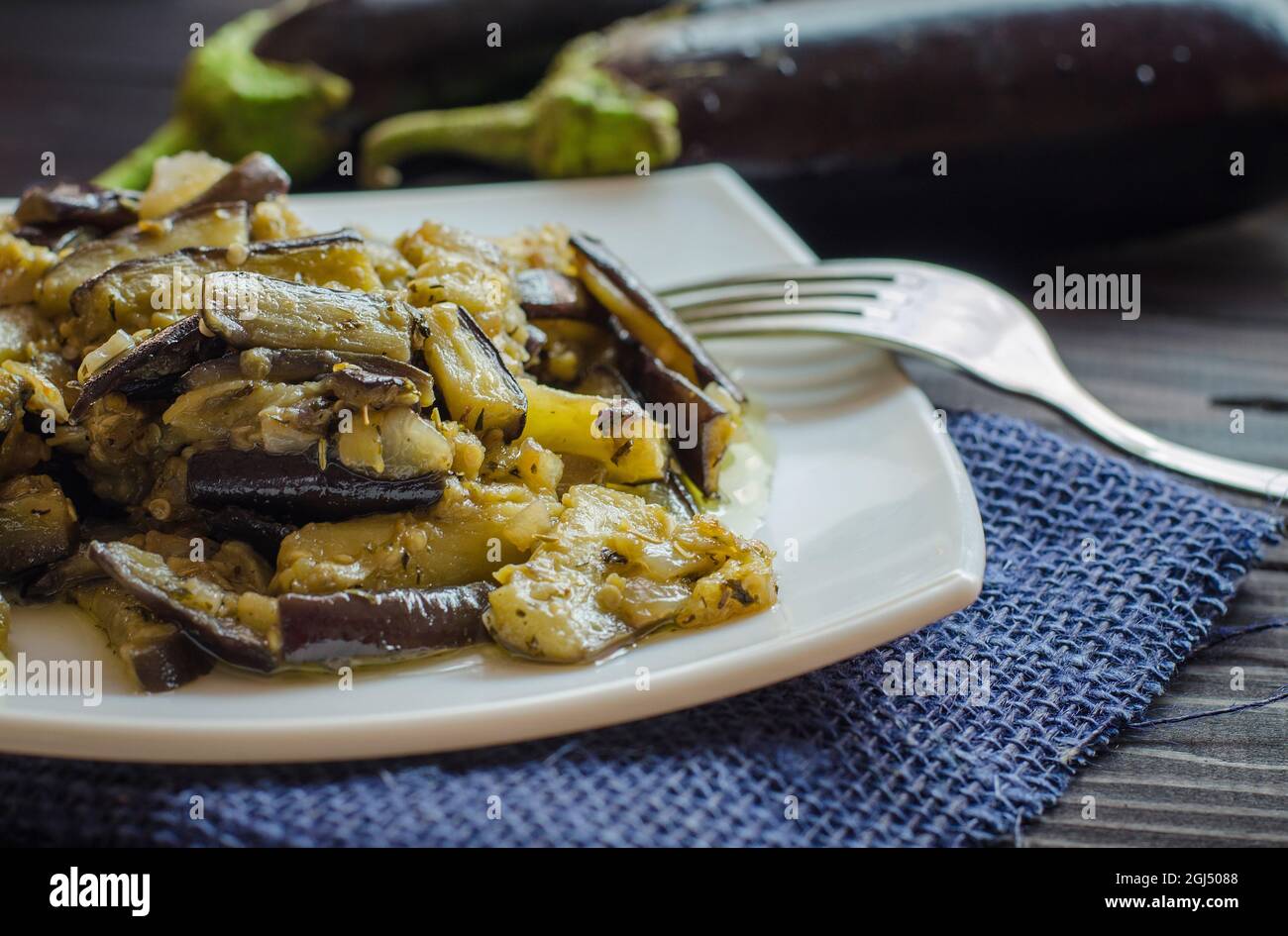fried eggplants with garlic on a plate Stock Photo Alamy