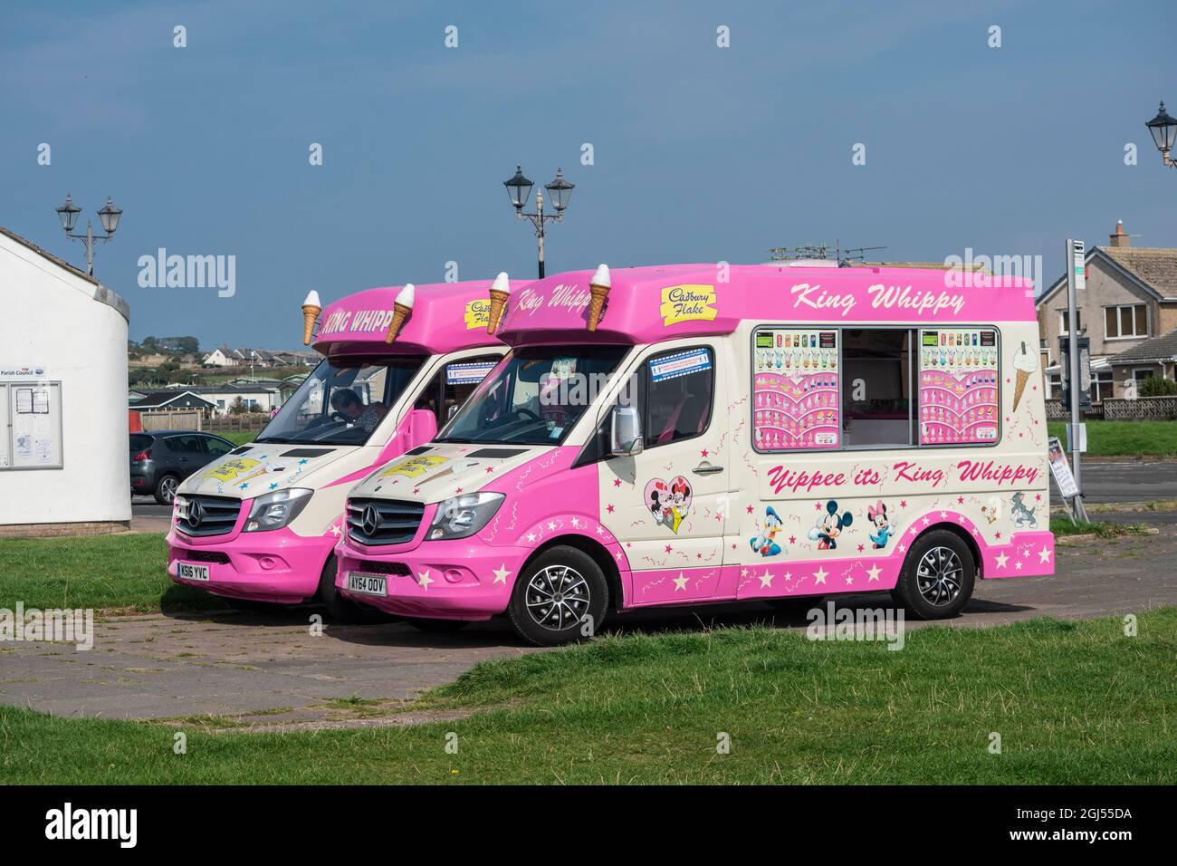Two ice-cream vans parked at the Cumbrian coastal town of St. Bees Stock Photo