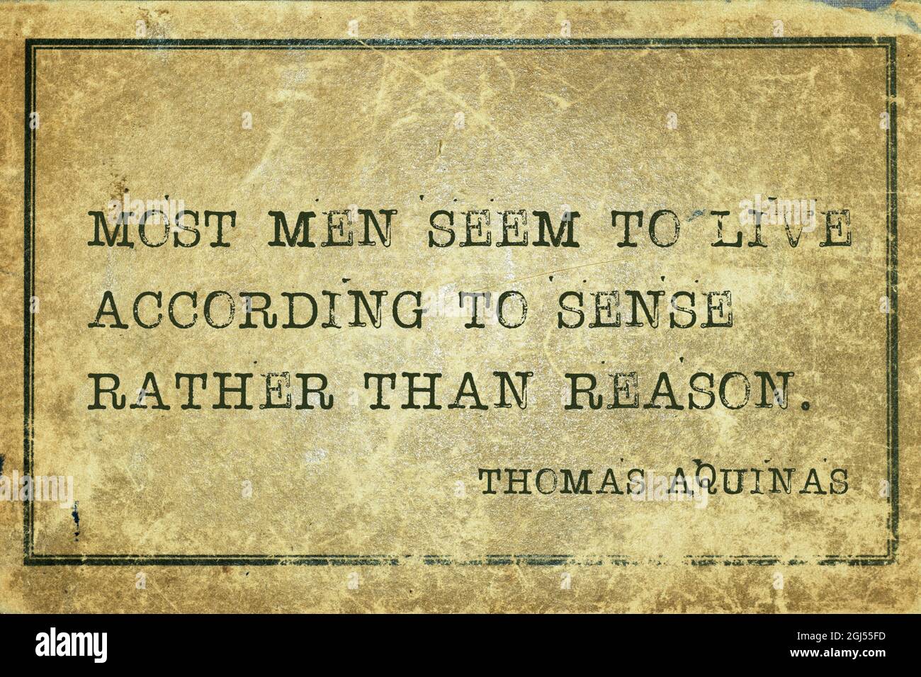 Most men seem to live according to sense rather than reason - quote of ancient Italian priest, theologian and philosopher Thomas Aquinas printed on gr Stock Photo