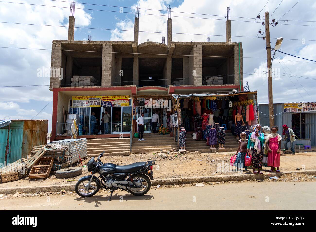 AXUM, ETHIOPIA, APRIL 27th.2019: Tigray native people in traditional market with clothes in center of Aksum on April 27, 2019 in Aksum, Tigray, Ethiop Stock Photo