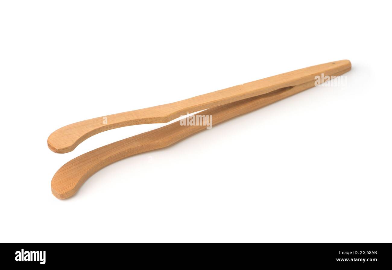 Wooden tongs isolated on white Stock Photo