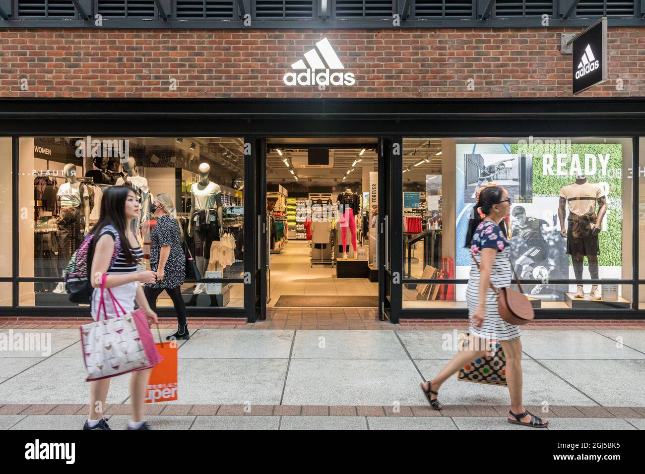 Portsmouth, UK. 08th Sep, 2021. People walk past an Adidas store at the  Gunwharf Quays Shopping Centre in Portsmouth. (Photo by Belinda Jiao/SOPA  Images/Sipa USA) Credit: Sipa USA/Alamy Live News Stock Photo -