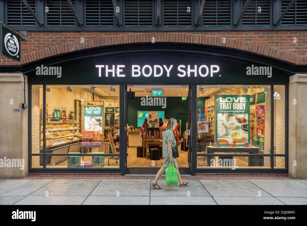 A woman walks past The Body Shop at the Gunwharf Quays Shopping Centre