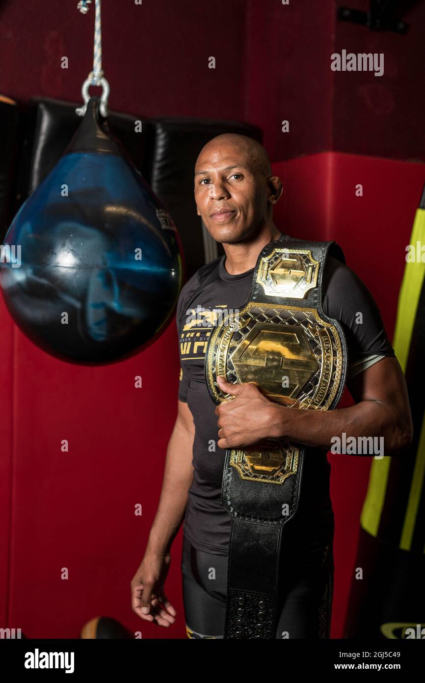 Portrait of Gael Grimaud, French MMA fighter, wearing his belt of MMA  Hexagone World Champion won during the first edition of MMA Hexagone in  Paris in July 2021. Paris, France, September 8th,