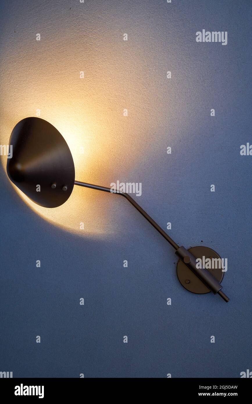 A uniquely designed incandescent art spotlight on the wall Stock Photo
