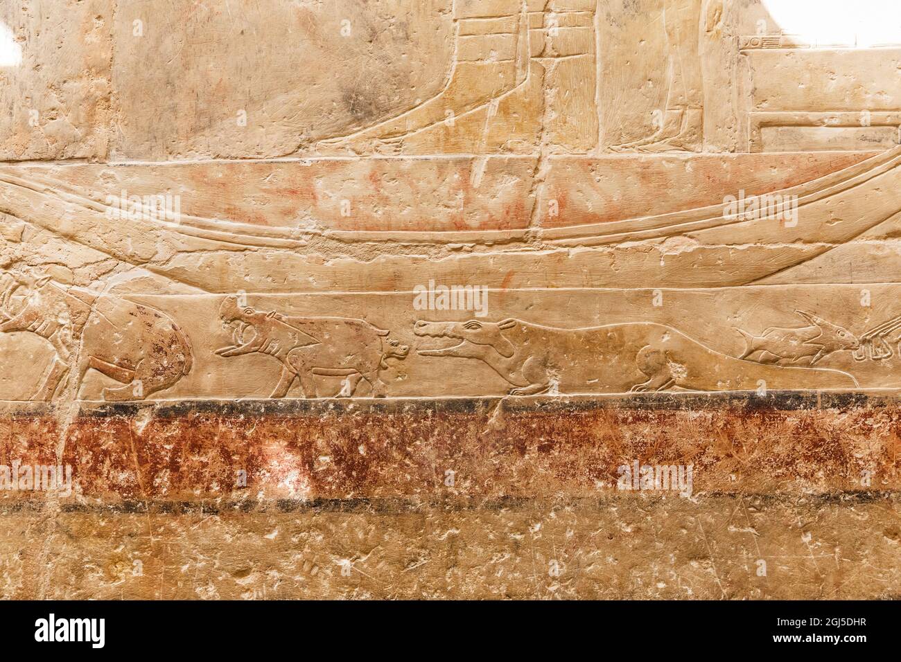 Africa, Egypt, Saqqara. Relief art showing a hippopotamus giving birth and a crocodile at the Step Pyramid of Djoser in the Saqqara necropolis. Stock Photo